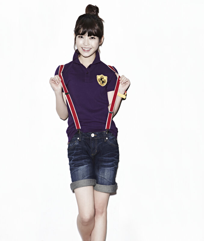 woman in purple polo and denim shorts