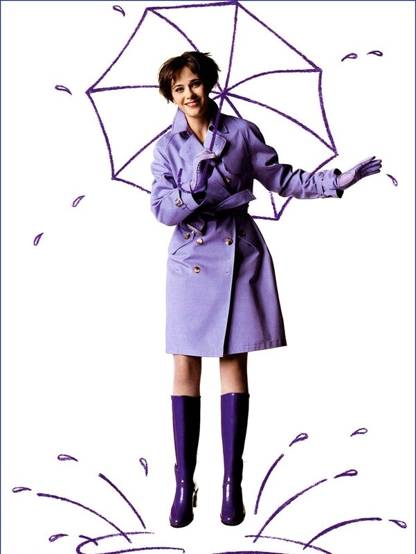 woman in purple raincoat