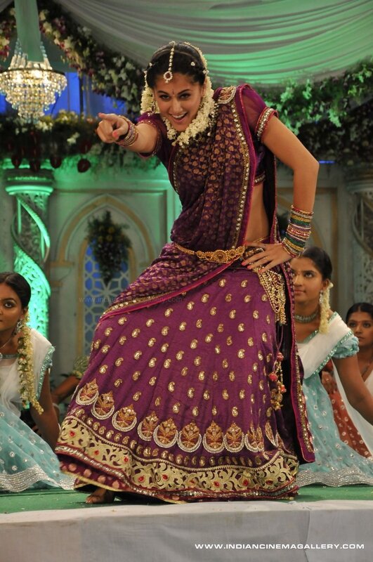 woman in purple sari dancing