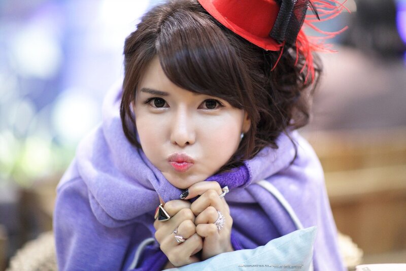 woman in purple scarf making a face
