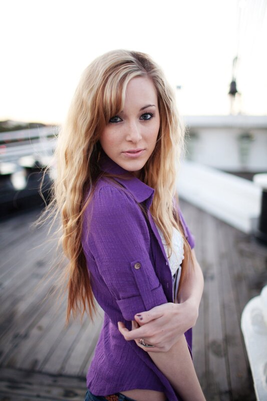 woman in purple shirt on deck