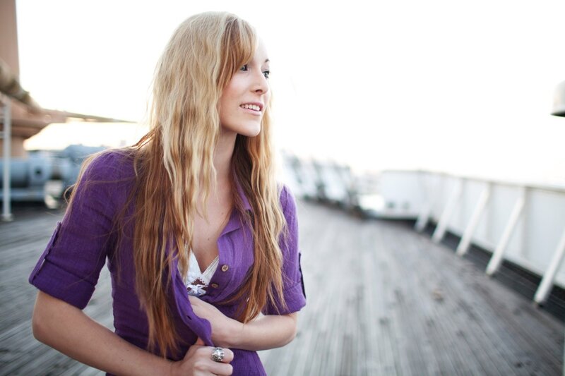 woman in purple shirt on deck