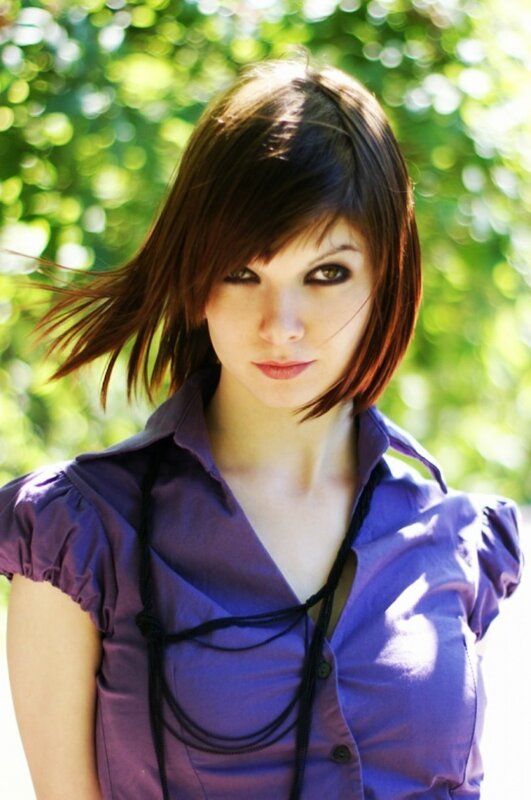 woman in purple shirt outdoors