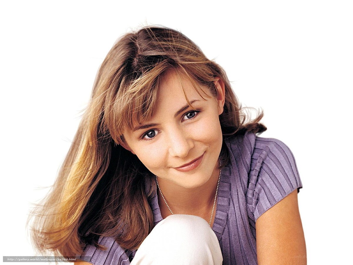 woman in purple shirt smiling
