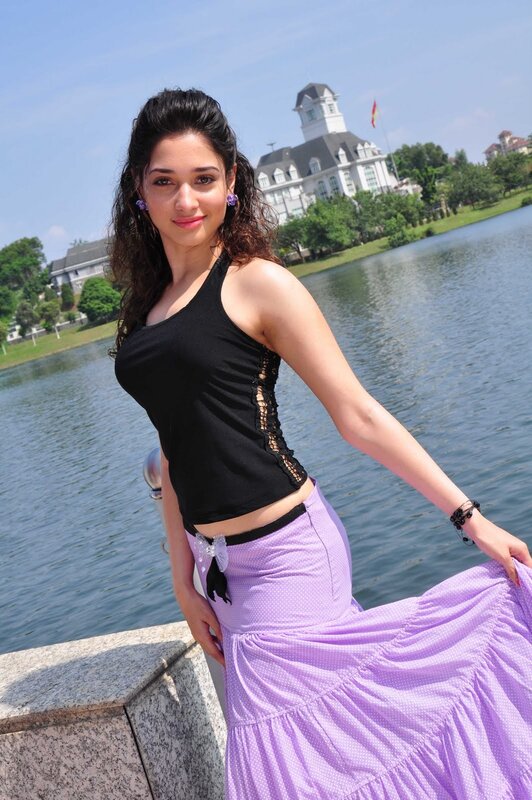 woman in purple skirt by lake