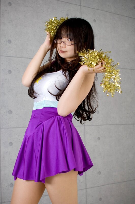 woman in purple skirt with pom-poms