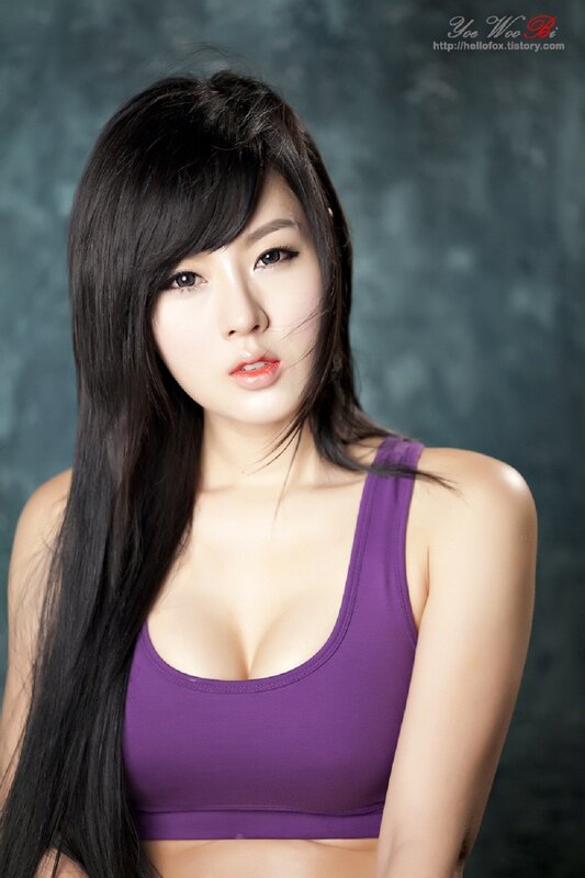 woman in purple sports bra