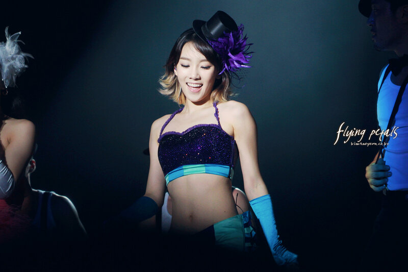 woman in purple stage costume