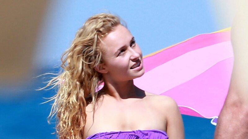 woman in purple swimsuit at beach