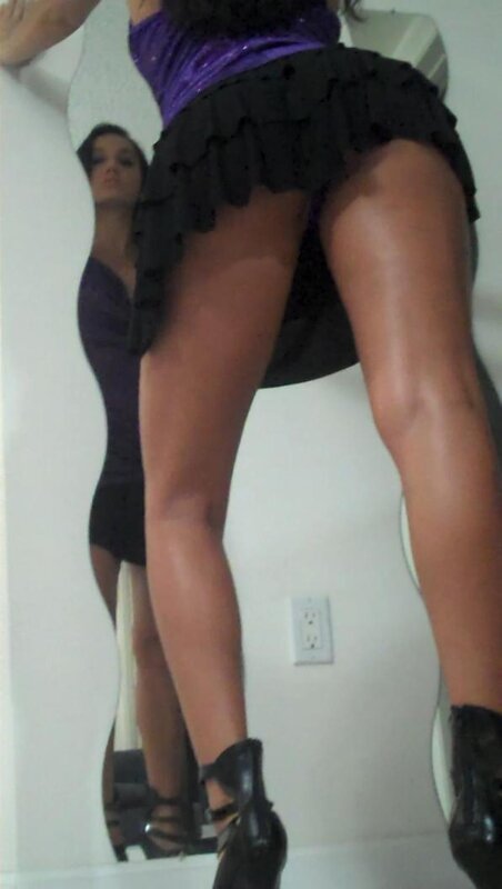 woman in purple top and black skirt
