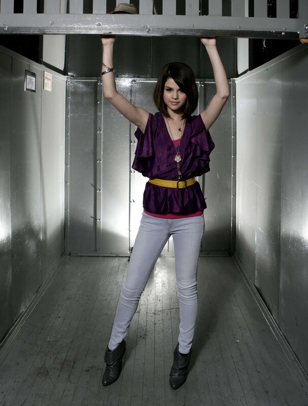woman in purple top holding beam
