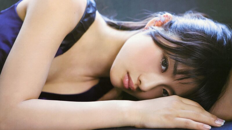 woman in purple top lying down