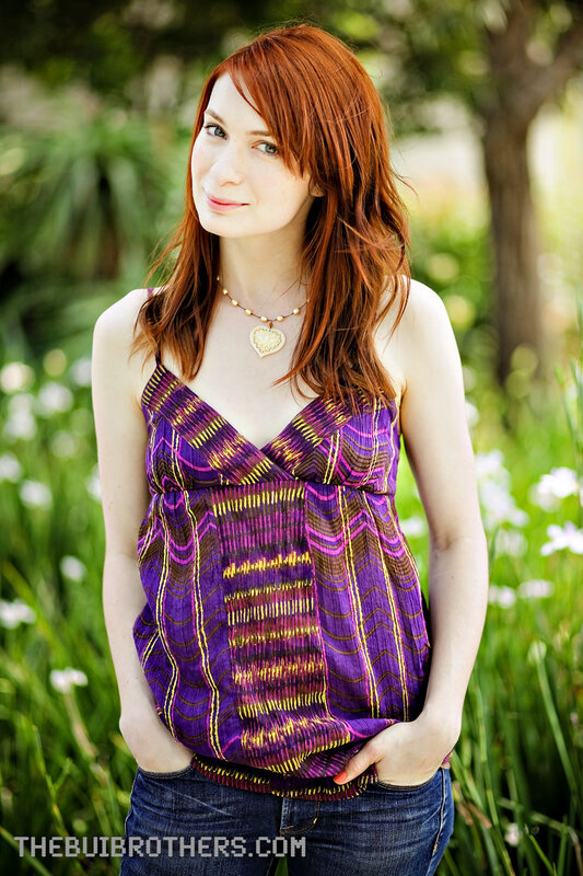 Woman in purple top outdoors