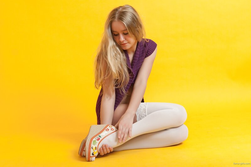 woman in purple top sitting