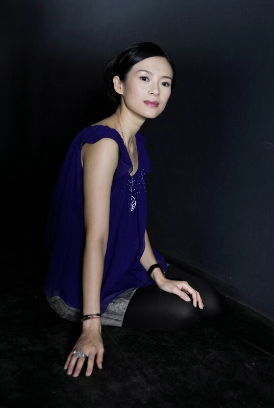 woman in purple top sitting