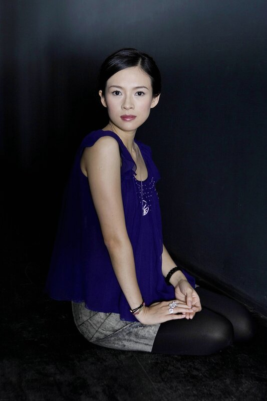 woman in purple top sitting