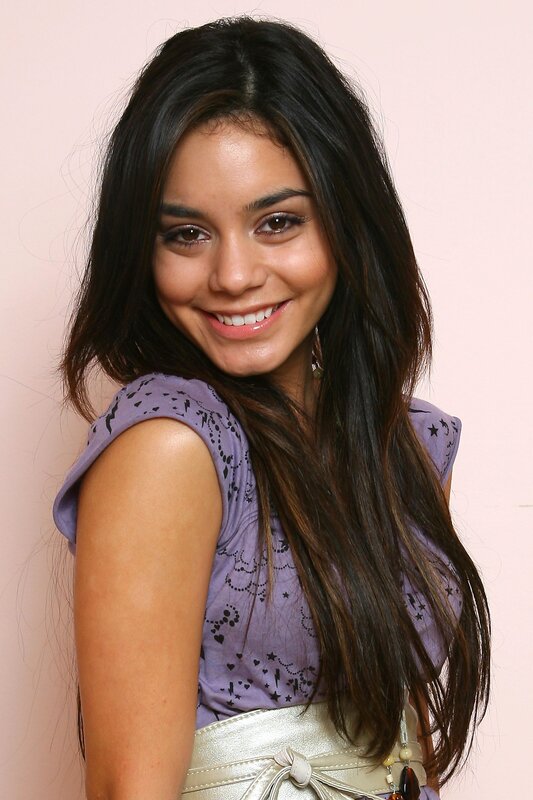 woman in purple top smiling