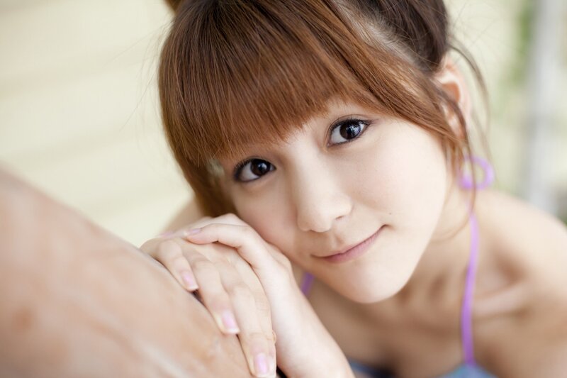 woman in purple top smiling
