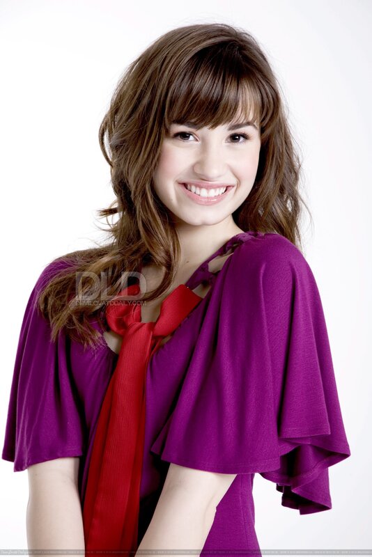 woman in purple top smiling