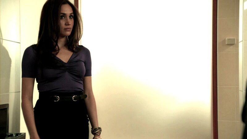 woman in purple top standing