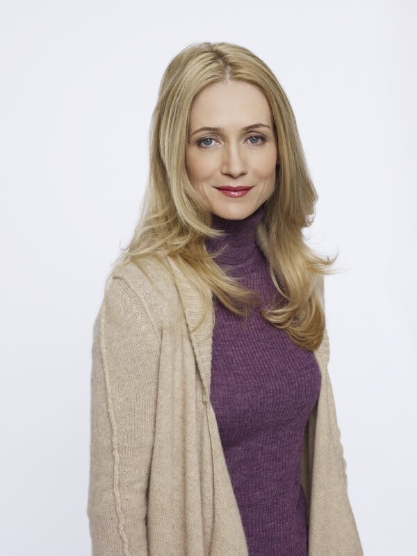 woman in purple turtleneck