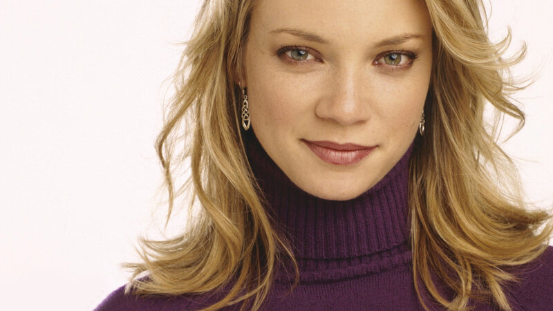 woman in purple turtleneck
