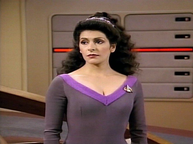 Woman in Purple Uniform — Serious