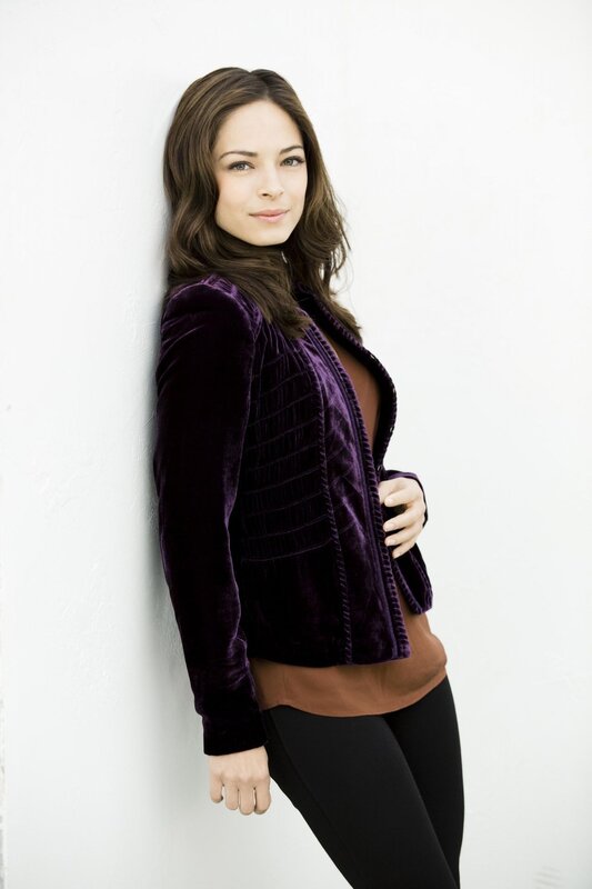 woman in purple velvet jacket