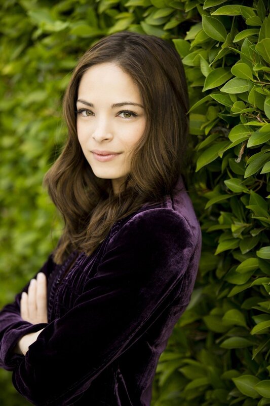 woman in purple velvet jacket