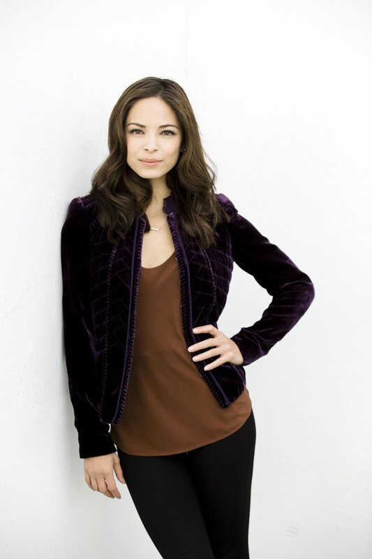 woman in purple velvet jacket