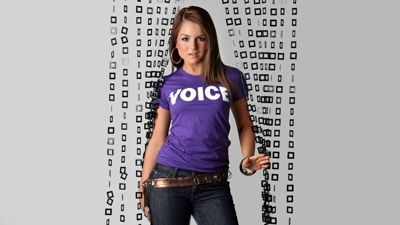 Woman in purple 'VOICE' t-shirt