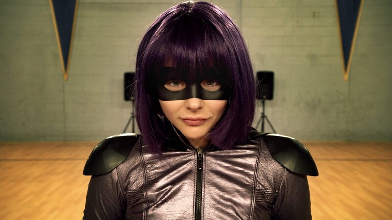 woman in purple wig and mask