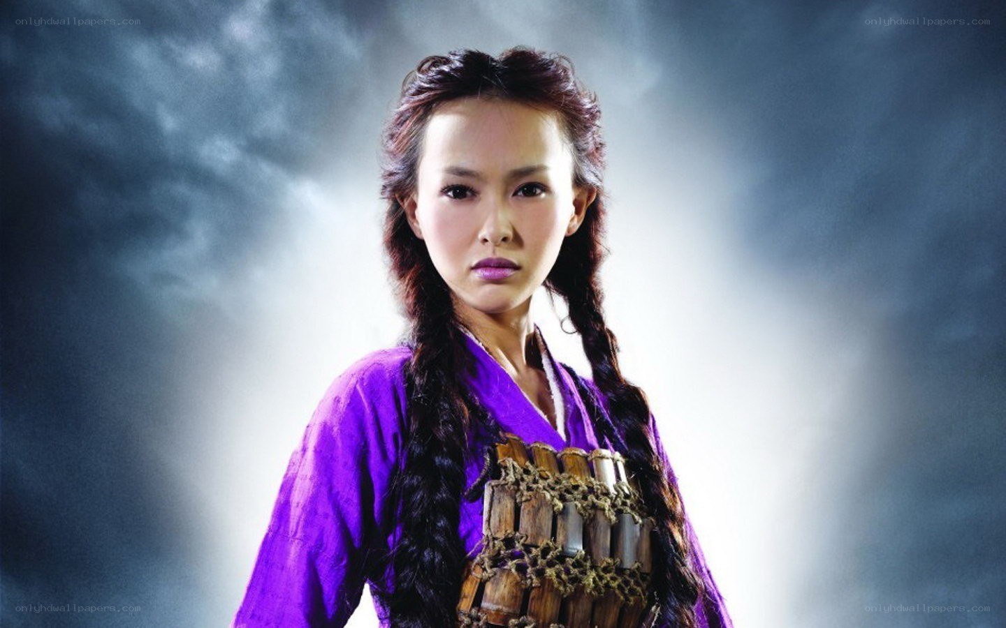 woman in purple with weapon