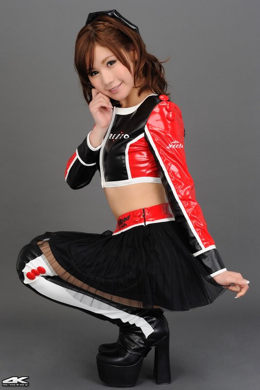 Woman in Racing Outfit — Black, Playful, Photograph