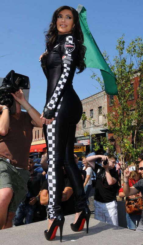 woman in racing suit on platform