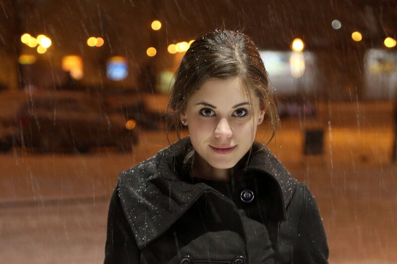 woman in rain at night