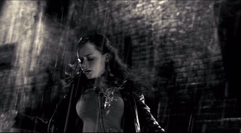 woman in rain at night