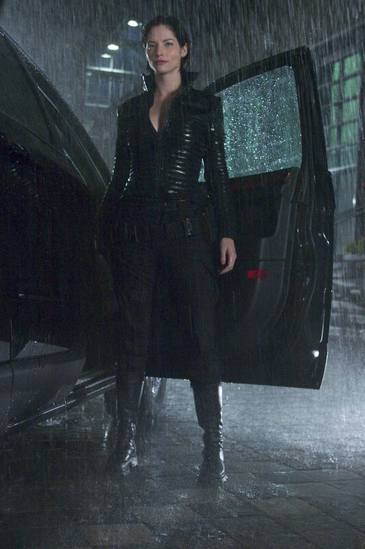 woman in rain by car