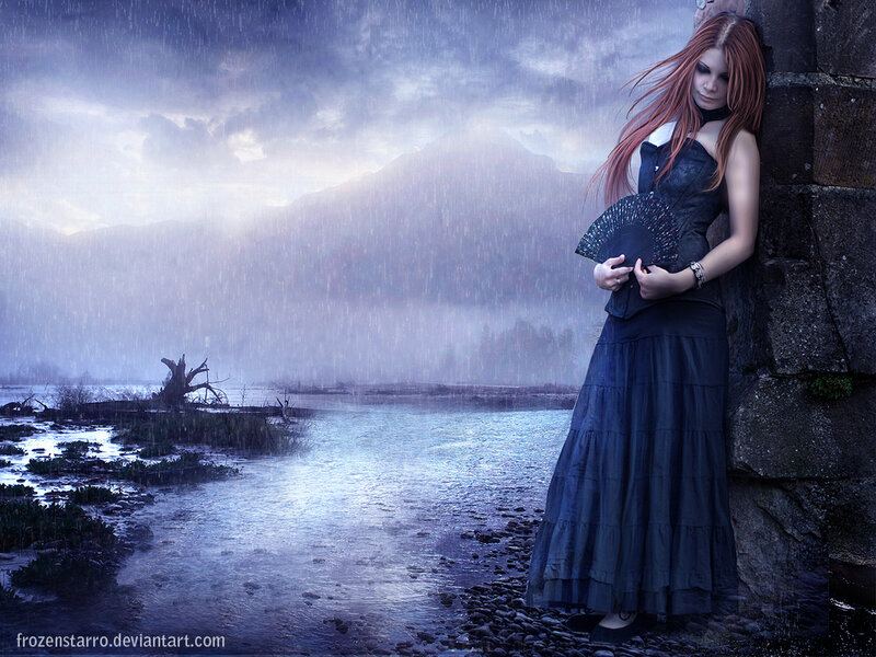 woman in rain by river