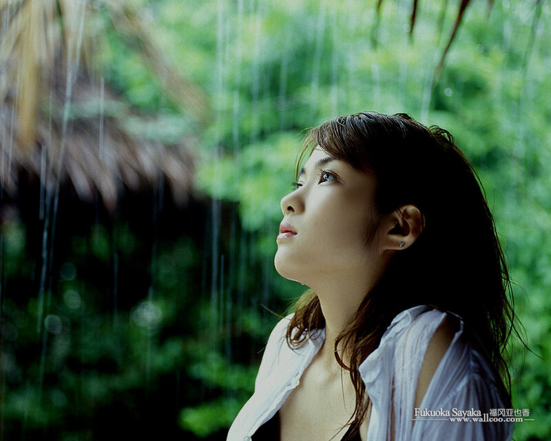 woman in rain looking up