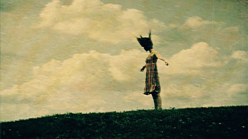 woman in rain on a hill
