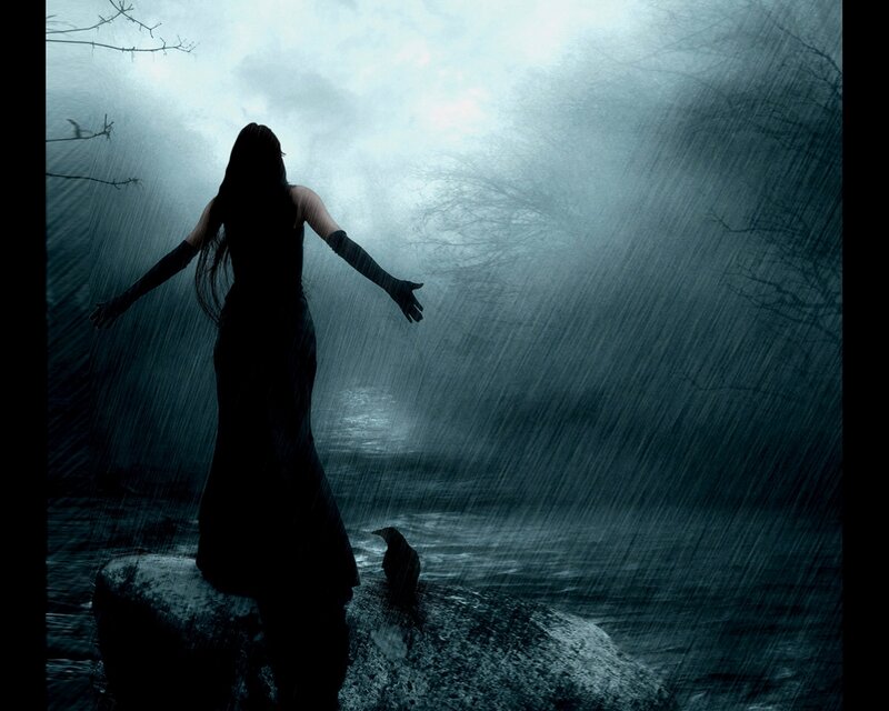 woman in rain on a rock