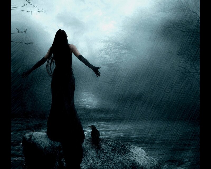 woman in rain on a rock