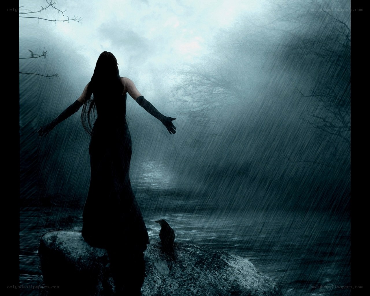woman in rain on a rock