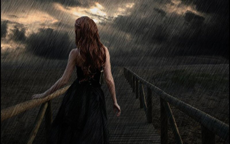 woman in rain on pier