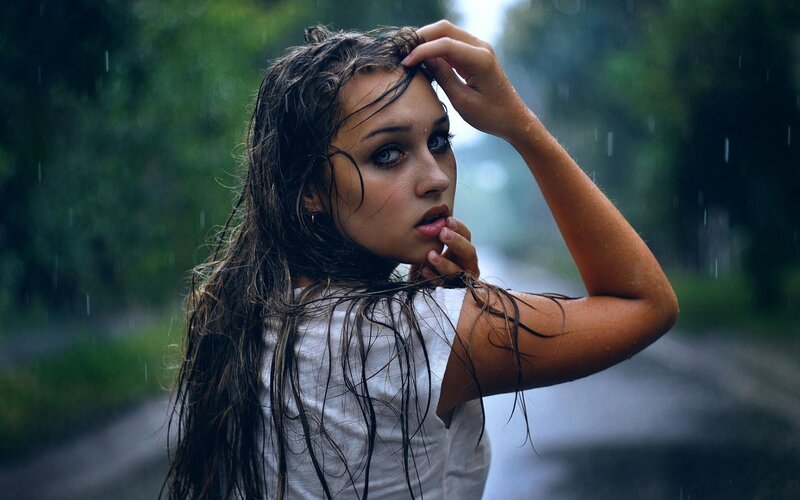 woman in rain on road
