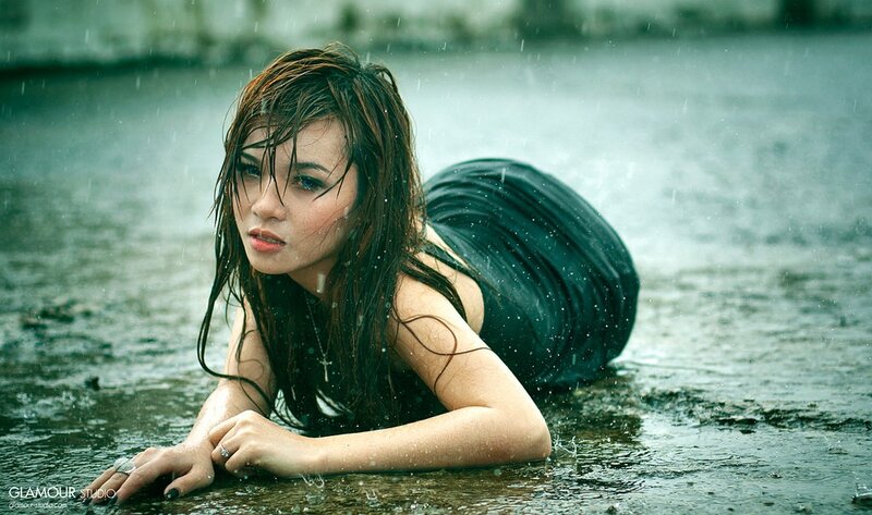 woman in rain on wet ground
