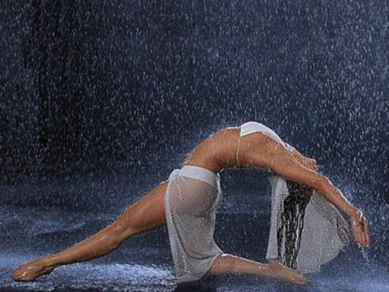 Woman in Rain Performing Yoga