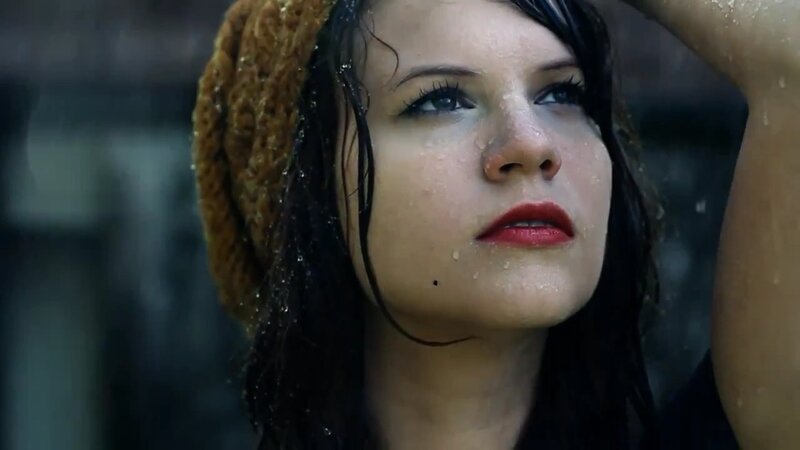 woman in rain with beanie