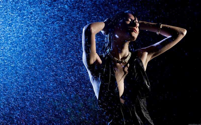 woman in rain with blue light